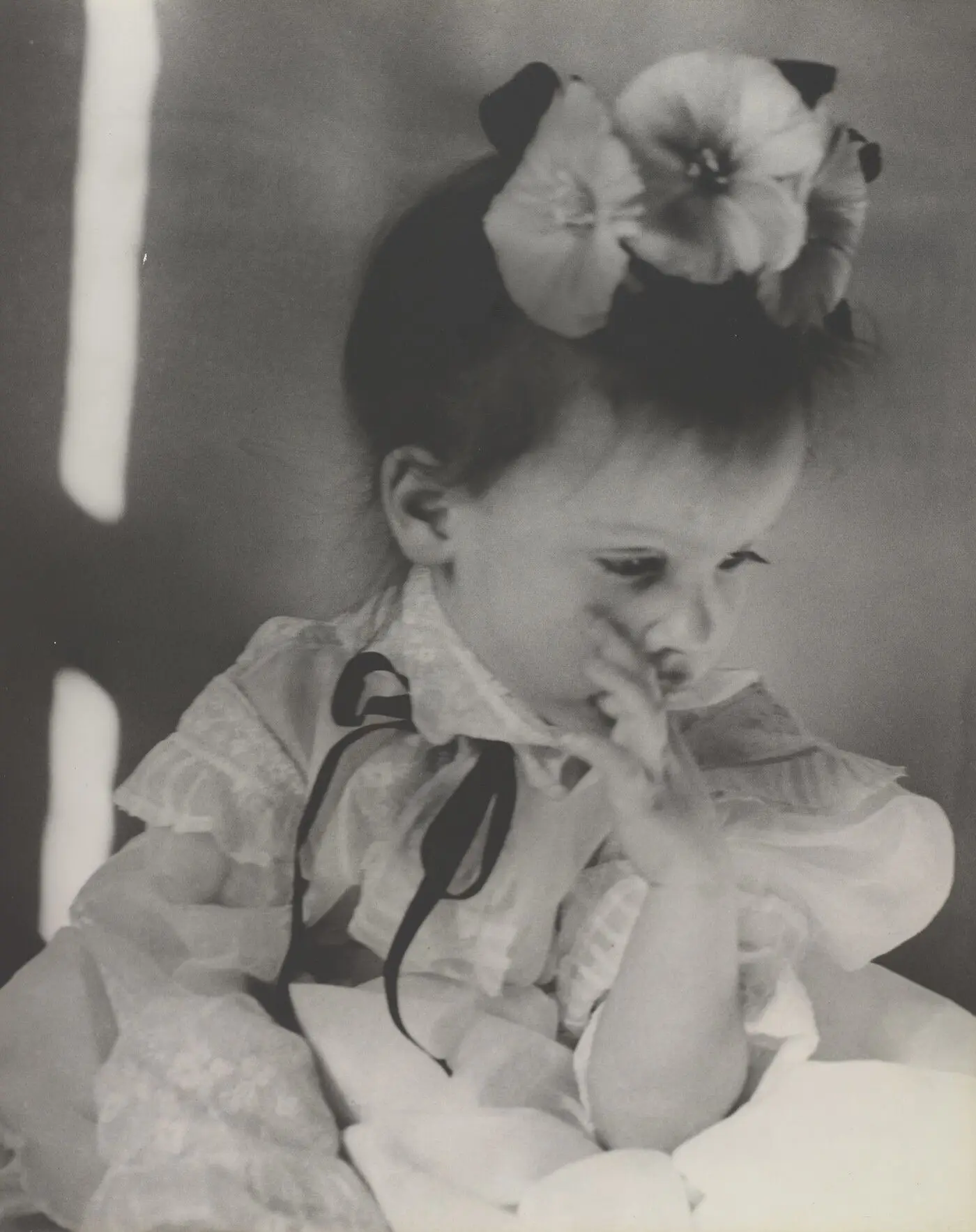 [Katherine, flowers in hair, hand at mouth] by Nell Dorr