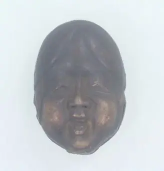 Ceramic Netsuke., Mask of Ofuku. by Unknown artist