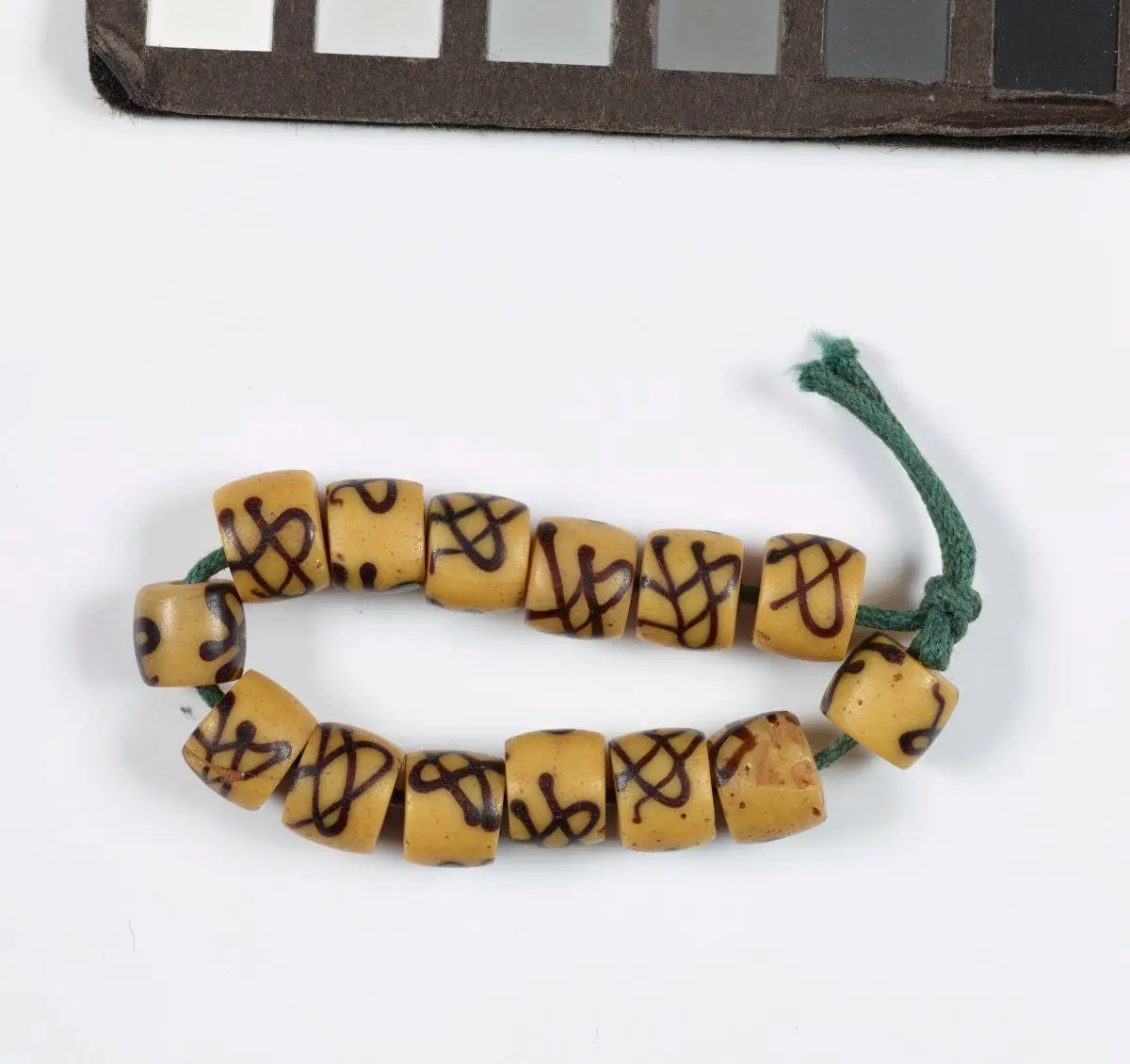 Partial strand of beads with decoration imitating native African beads by Unknown artist