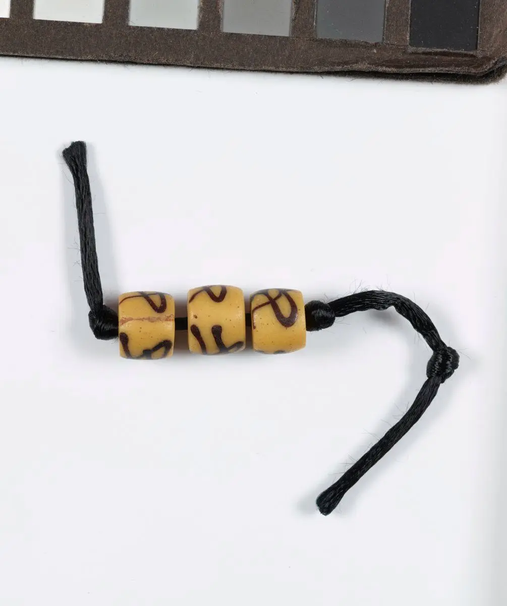 Partial strand of beads with decoration imitating native African beads by Unknown artist