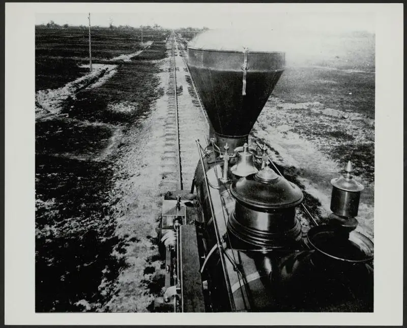 Pounding down the main line of the Central Pacific behind a pioneer woodburner that came around the tip of South America by sailing ship after being manufactured on the East Coast by Central Pacific Railroad Company