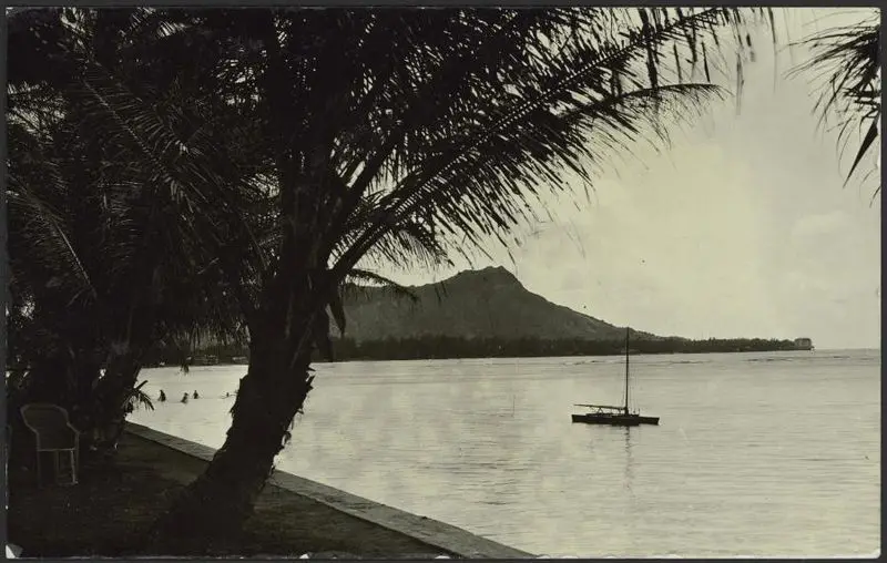 Bay view with a small boat and swimmers by Unknown artist