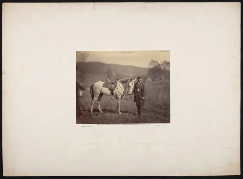 Soldier beside horse by Gardner