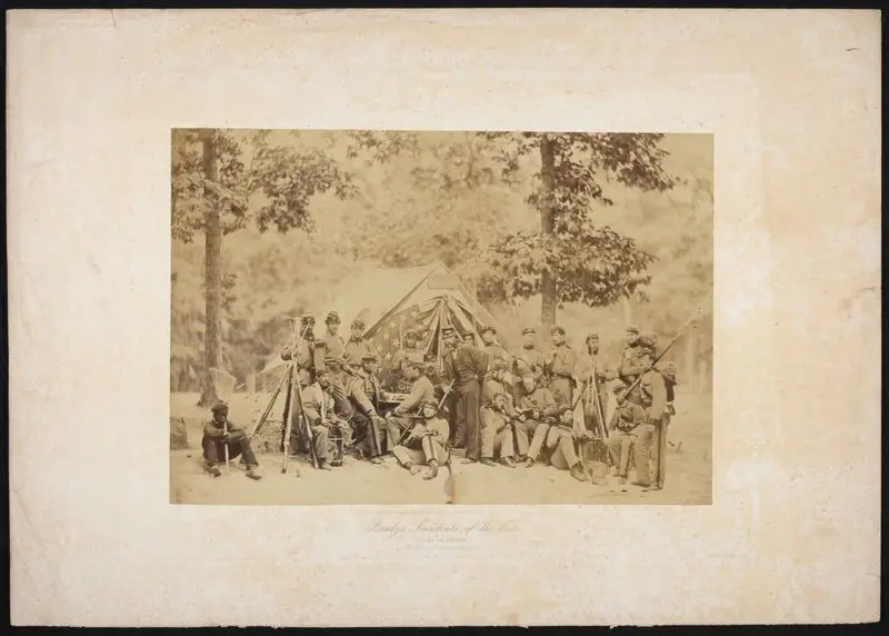 Brady's Incidents of the War. (Camp McDowell) 8th Regt. N.Y.S.T. Arlington Heights, Va. [Group portrait beside engineer's tent]. by Brady's National Photographic Portrait Galleries