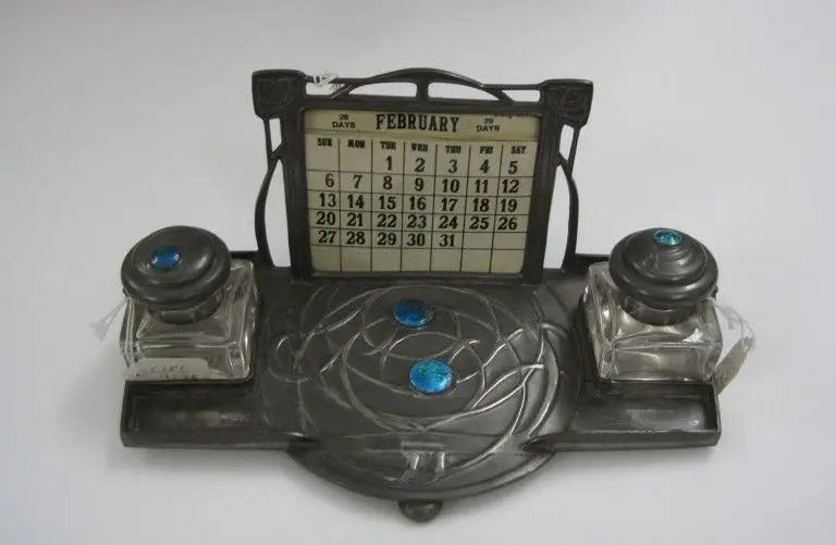 Pewter with enamel decoration, glass and celluloid, Birmingham, 1905-10, made by W.H. Haseler for Liberty & Co., probably designed by Archibald Knox. by Knox, Archibald