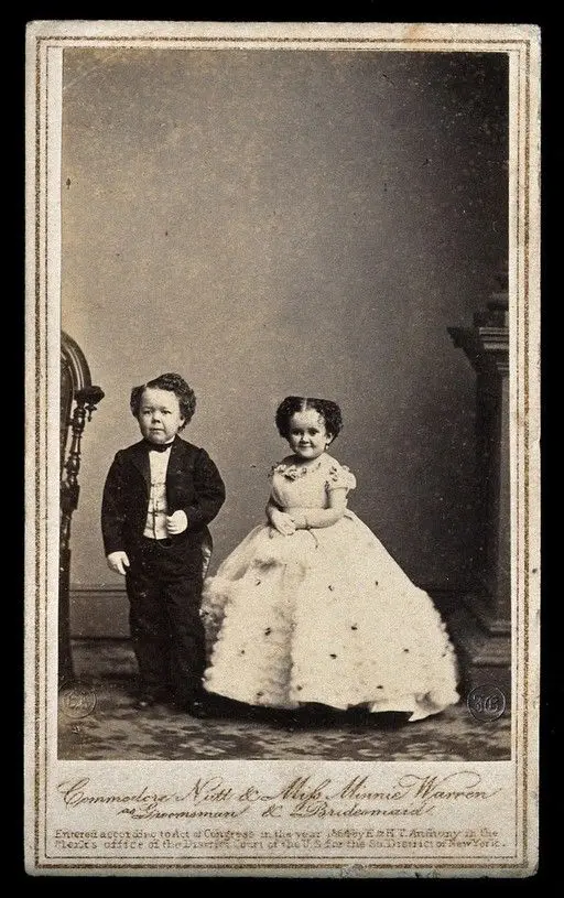 Two dwarfs: Minnie Warren and Commodore Nutt, bridesmaid and groomsman at the wedding of General Tom Thumb in New York. Photograph by Mathew Brady, 10 February 1863. by Mathew B. Brady