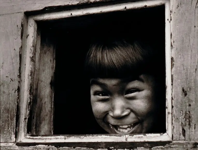 Untitled [Inupiaq boy at window, Barrow, Alaska] by Sam Isamu Kimura