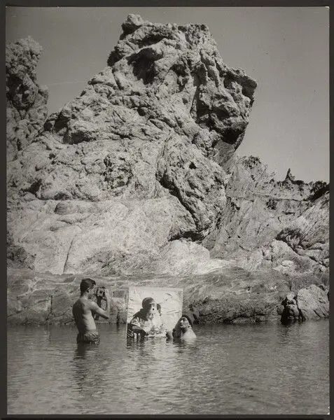 [R. Descharnes photographing Dali with Vermeer, Port Lligat] by Brassaï