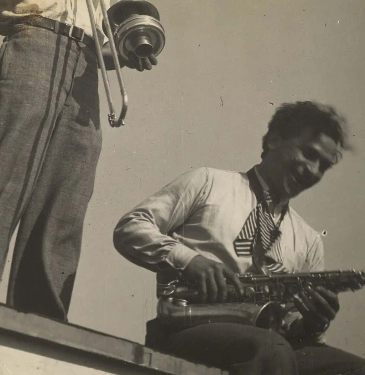 [Xanti Schawinsky with Saxophone]. by T. Lux Feininger