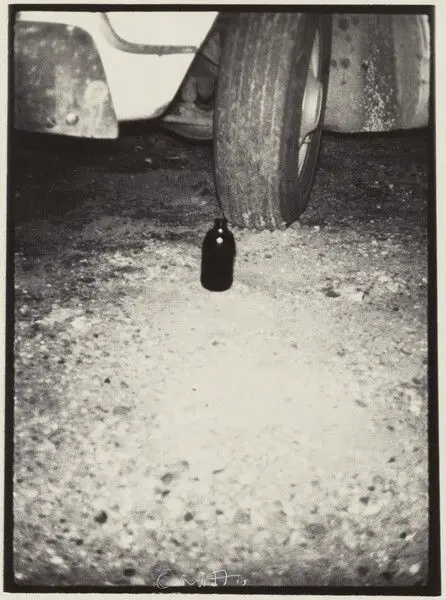 Bottle Near Tire by Bill Arnold