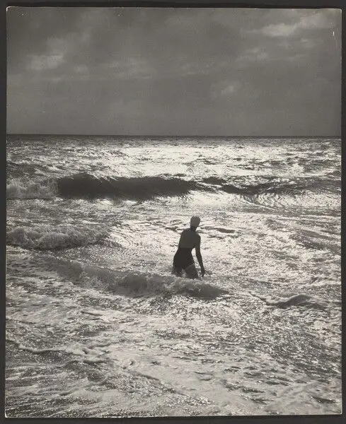 [Figure standing in ocean] by Andreas Feininger