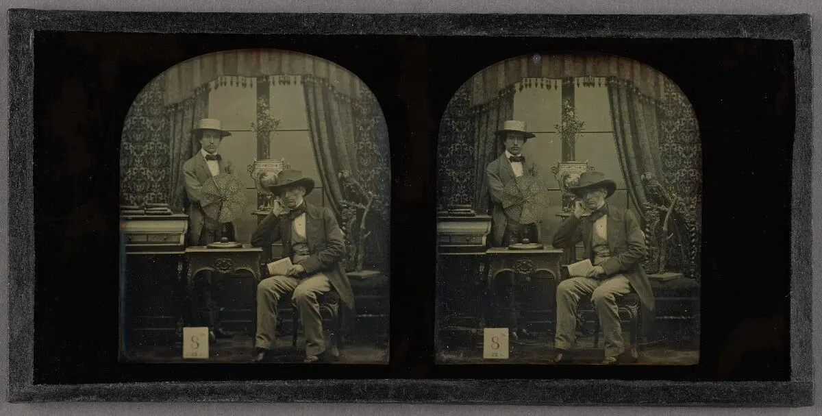 [Self-portrait of Antoine François Jean Claudet and his son Henri Posed with His Invention, The Focimeter] by Antoine Claudet