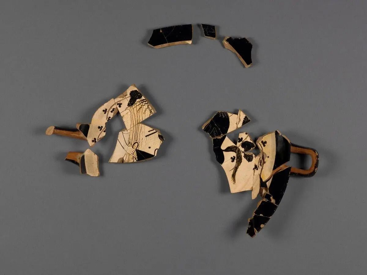 Attic White-Ground Cup (Lipped Inside) Fragment with Dionysos and a Satyr and One Black-Gloss Cup Fragment (rim) by Onesimos