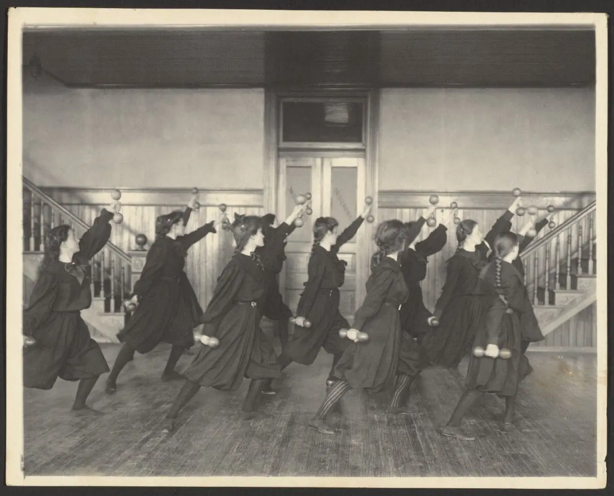 [Girls exercising with hand weights] by Frances Benjamin Johnston