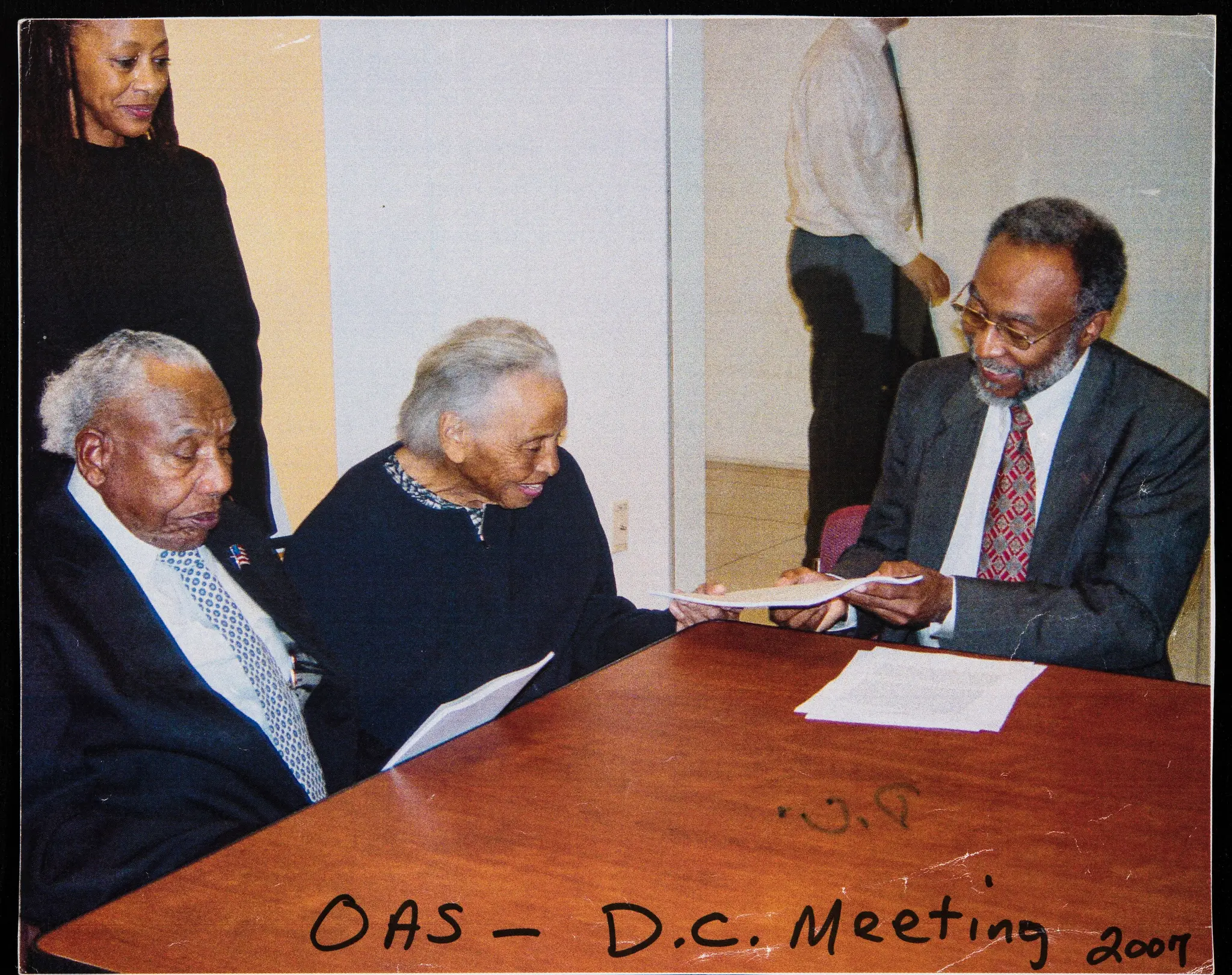 Organization of American States meeting in Washington, District of Columbia with survivors Otis Granville Clark of Oklahoma City, Oklahoma and Dr. Olivia Hooker of White Plains, New York, with unidentified man by Organization of American States