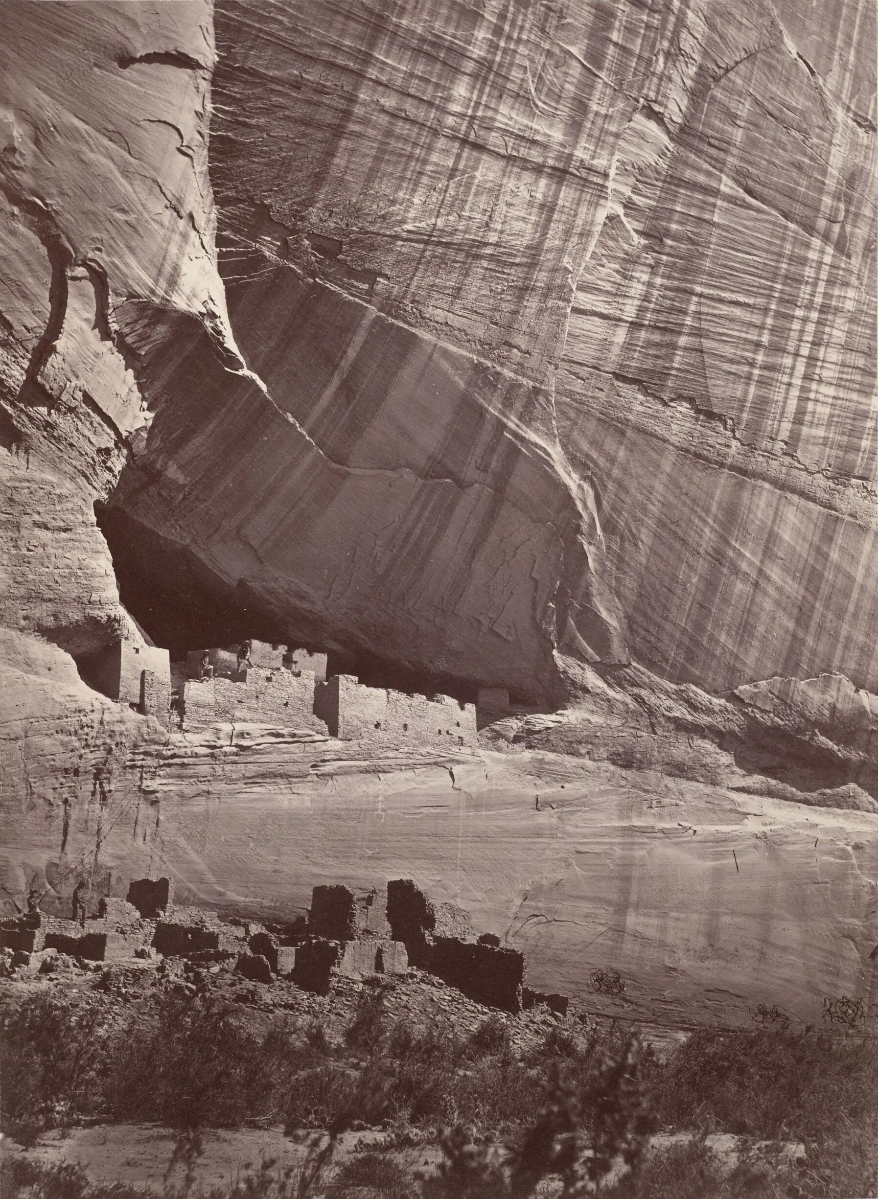 Ancient Ruins in the Cañon de Chelle, N.M. In a niche 50 feet above present cañon bed. by Timothy H. O'Sullivan