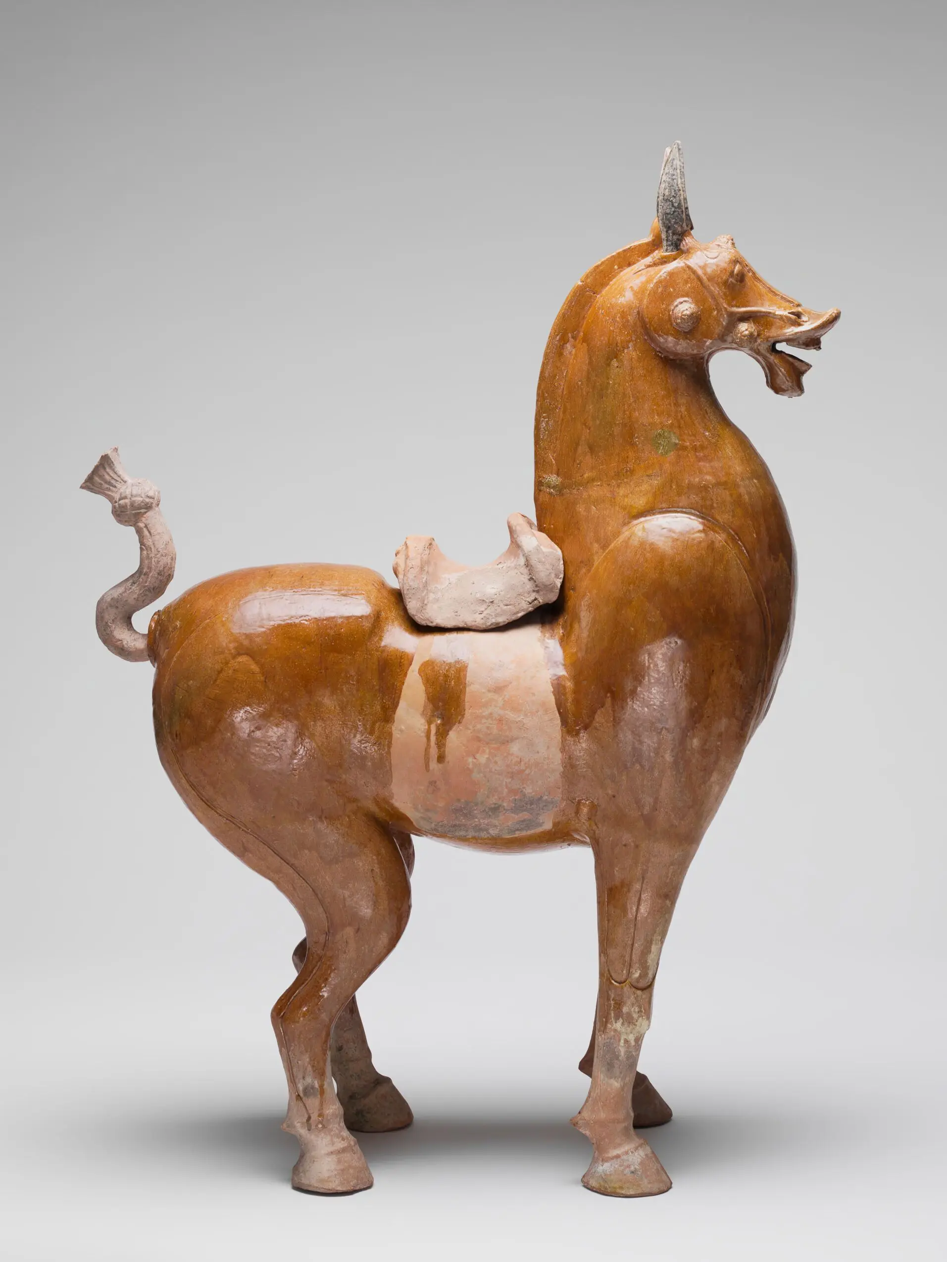 Standing Saddled Horse with Clipped Mane, Cropped and Tied Tail, and Roman-Style Bridle Ornaments by Unknown artist