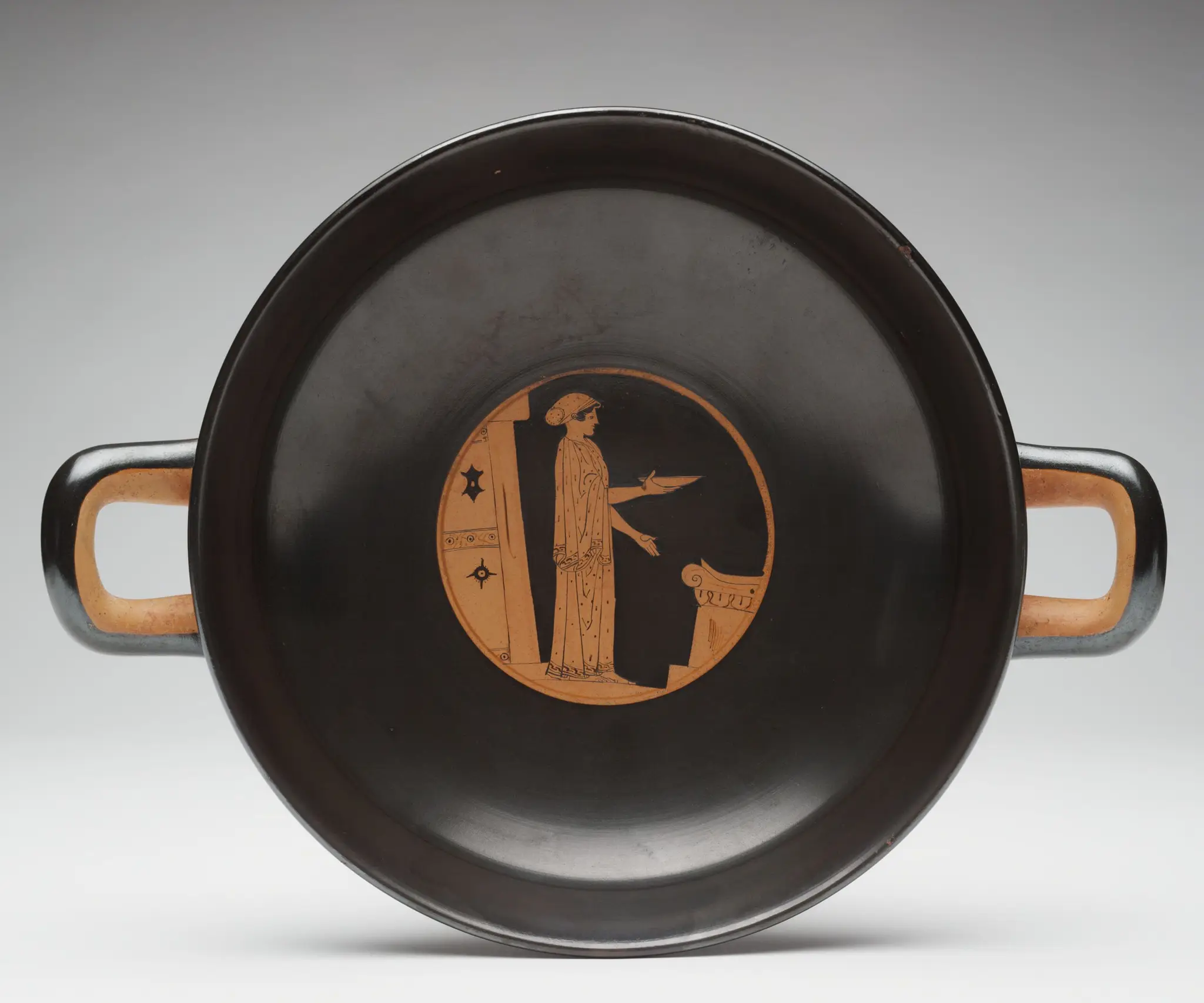 Kylix (drinking cup): Woman Pouring a Libation at an Altar by The Akestorides Painter