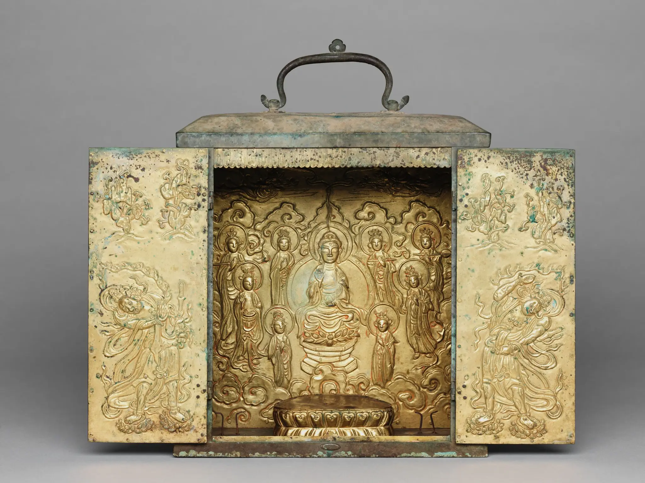 Portable Buddhist Shrine with Two Removable Standing Bodhisattvas, a Lotus Base for a Seated Buddha Image (now missing), a Repoussé Panel Depicting the Buddha Amitabha (Amit'abul), and Repoussé Panels on the Doors Representing Guardian Figures by Unknown artist