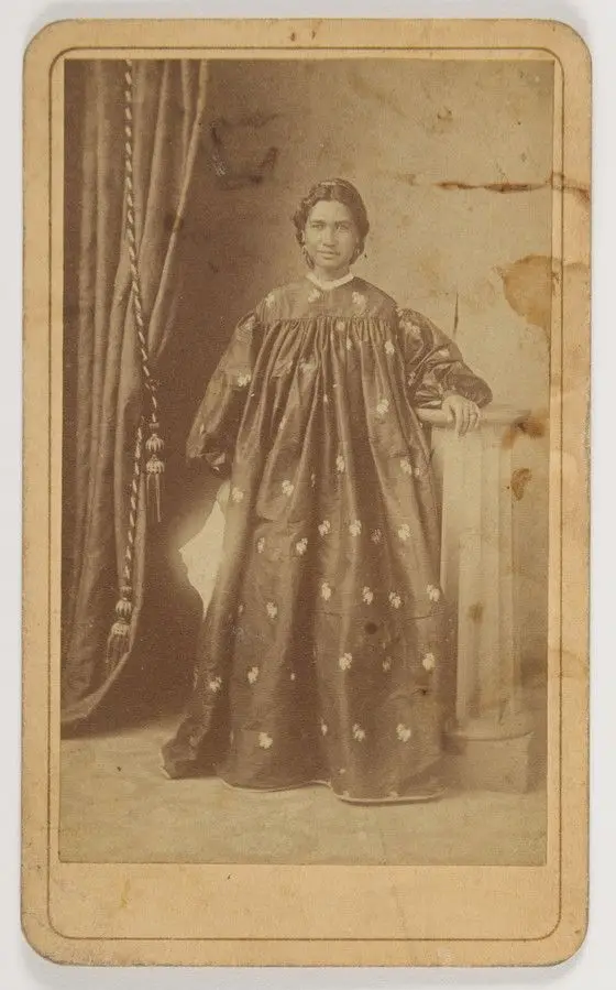 Hawaiian Woman in Holokū by H.L Chase