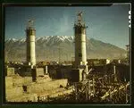 Partly finished open hearth furnaces and stacks for a steel mill under construction which will soon be producing vitally needed steel, Columbia Steel Co., Geneva, Utah by feininger, andreas