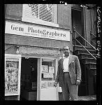 [Photographer Robert H. McNeill in front of Gem Photographers, operated by Larry Grymes and Robert McNeill, Washington, D.C.] by mcneill, robert h.