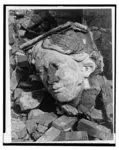 [Fragment of architectural decoration from above doorway of a sculpted head of a woman lying on pile of rubble from the demolition of the Civic Repertory Theatre] by Siskind, Aaron, photographer. by Siskind, Aaron, photographer.