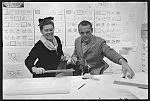 [Ray Eames and Charles Eames at drafting table, Eames Office] by Office of Charles and Ray Eames. by Office of Charles and Ray Eames.