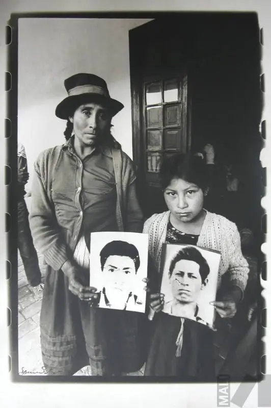 Con los retratos de padre e hijo desaparecidos, Ayacucho by Carlos Domínguez Hernández