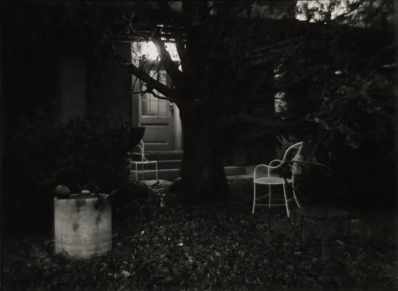 Untitled [chairs in yard under bare tree in fall] by Josef Sudek