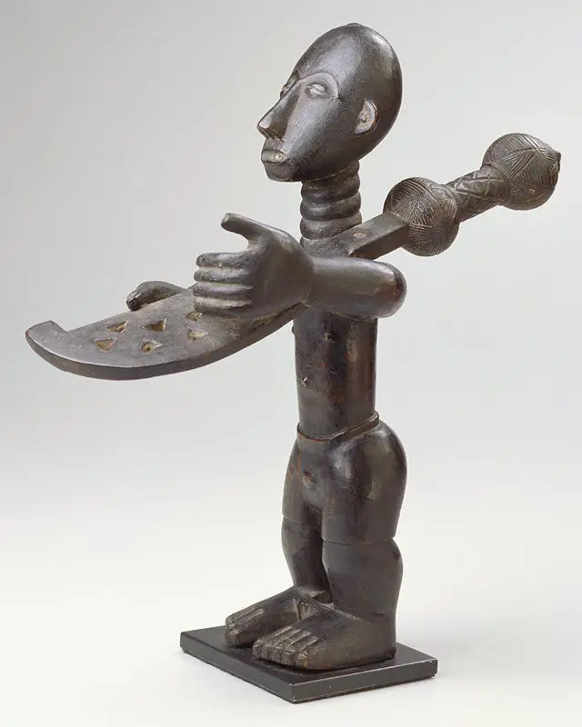 Man Carrying an Executioner's Sword, from a shrine group by Kwaku Benpoh