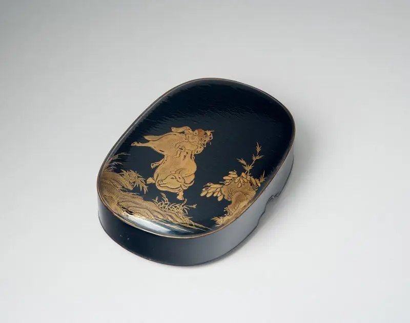 Lacquer box with design of herdboy on an ox by Japan