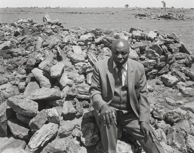 Luke Kgatitisoe in his house, bulldozed in February 1984 by the government after the forced removal of the people of Magopa, a black-owned farm, which had been declared a “black spot”, Ventersdorp district, Transvaal, 21 October 1986 by David Goldblatt