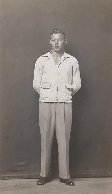 Standing man, hands behind back by Mike Disfarmer