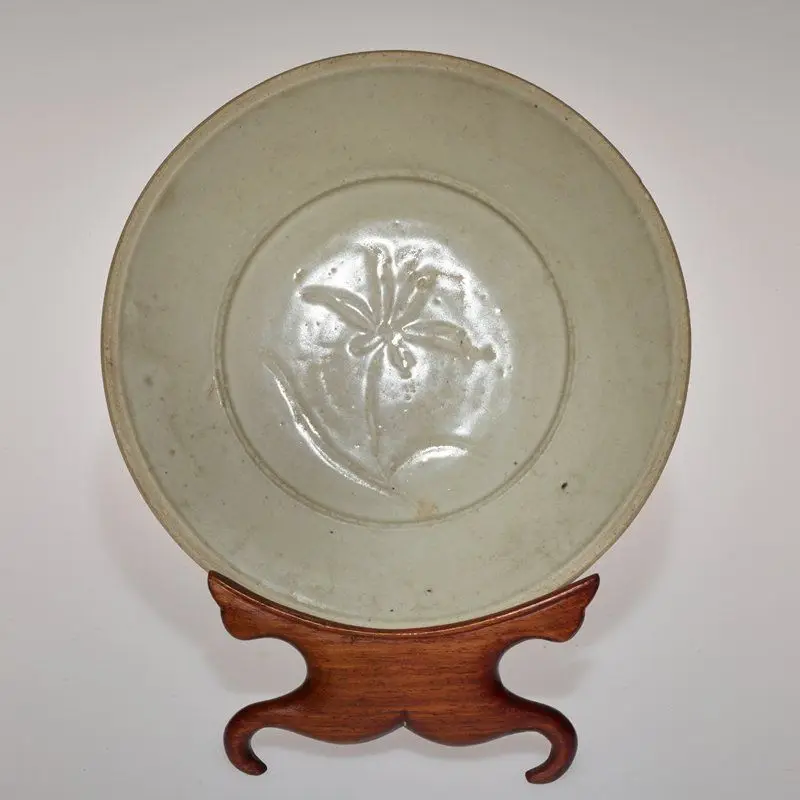 Stoneware bowl with Qingbai glaze depicting a flower by China