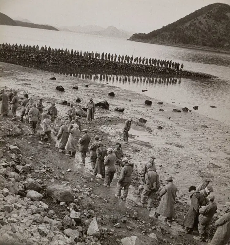 North Korean and Chinese Prisoners Building a Breakwater, Koje-do, Korea by Werner Bischof