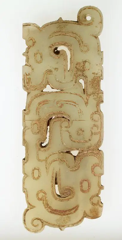 Pendant in the form of a man flanked by a pair of dragons by China