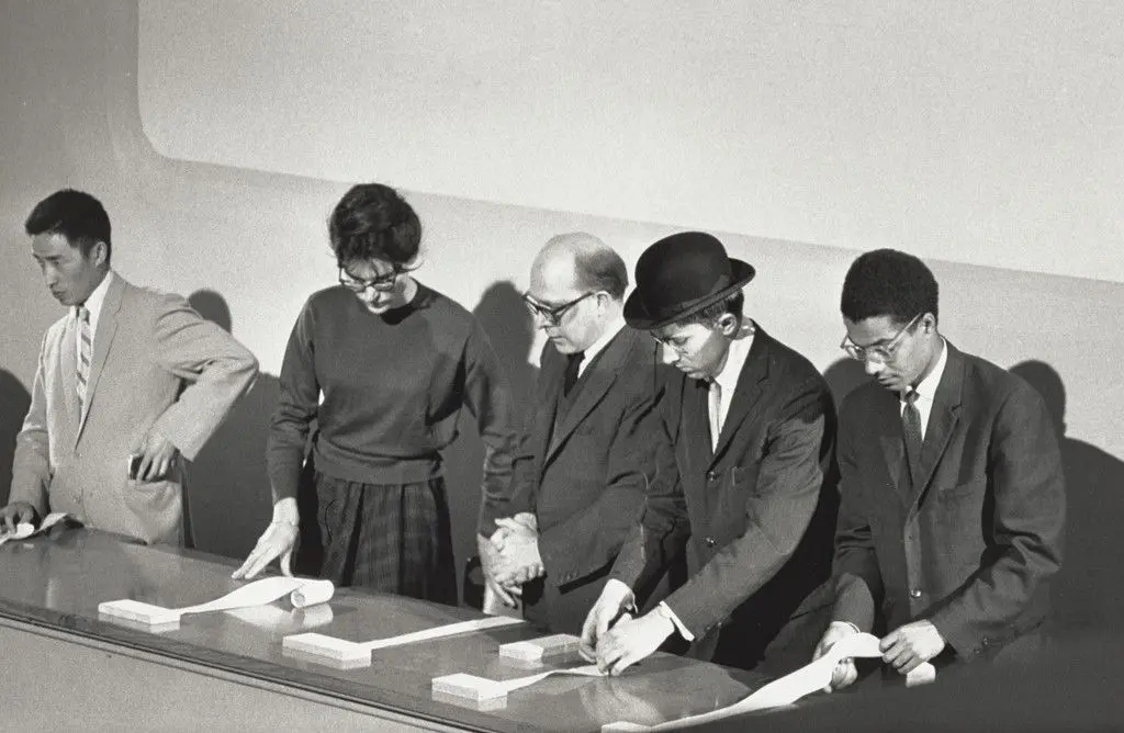 George Maciunas' In Memoriam to Adriano Olivetti, performed during Concert No. 5, Fluxus Internationale Festspiele Neuester Musik, Städtisches Museum, Wiesbaden, September 8, 1962 by Nam June Paik, Alison Knowles, Emmett Williams, George Maciunas, Benjamin Patterson, George Maciunas