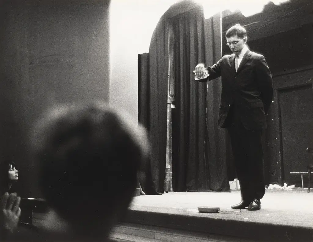 George Brecht's Drip Music (1962), performed by George Maciunas during Fluxus Festival, Hypokriterion Theater, Amsterdam, June 23, 1963 by George Brecht