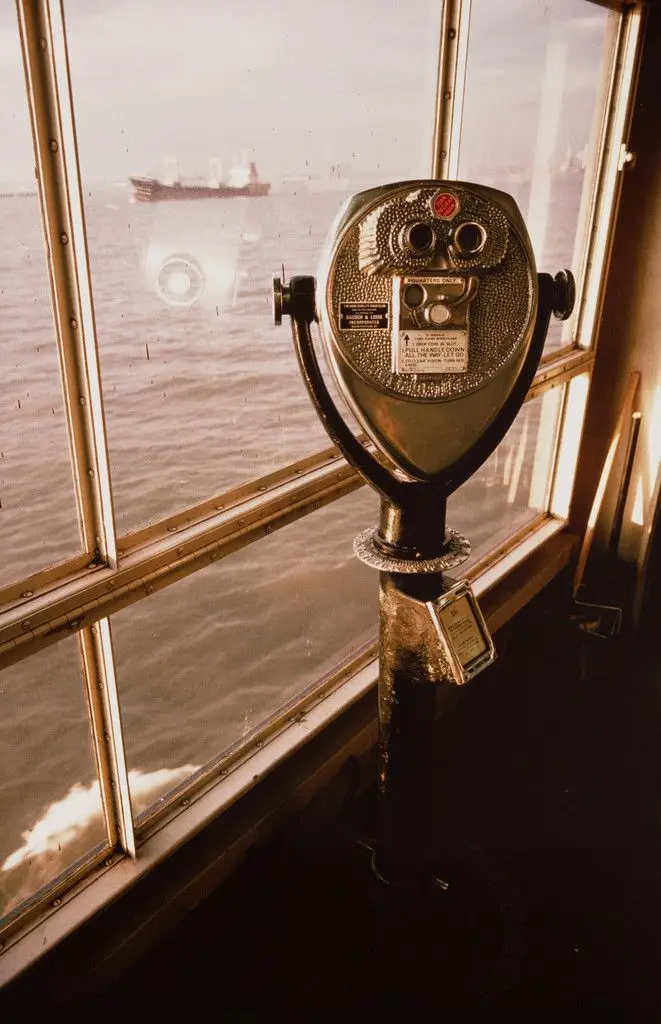 Boy looking at his mother. Staten Island Ferry. New York harbor from the series Fish Story by Allan Sekula
