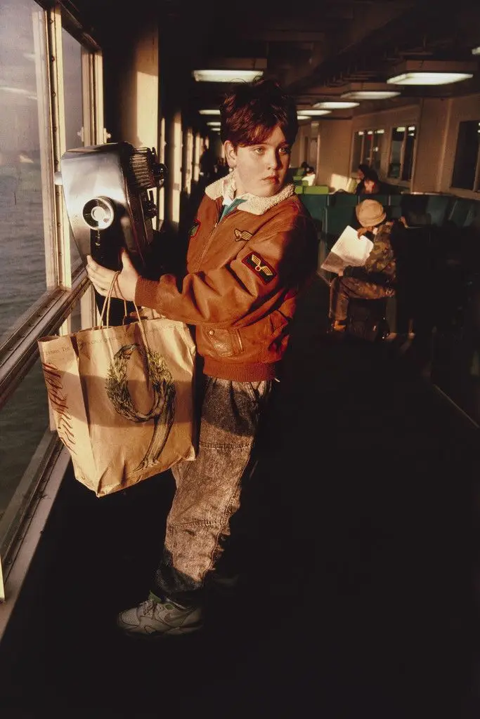 Boy looking at his mother. Staten Island Ferry. New York harbor from the series Fish Story by Allan Sekula