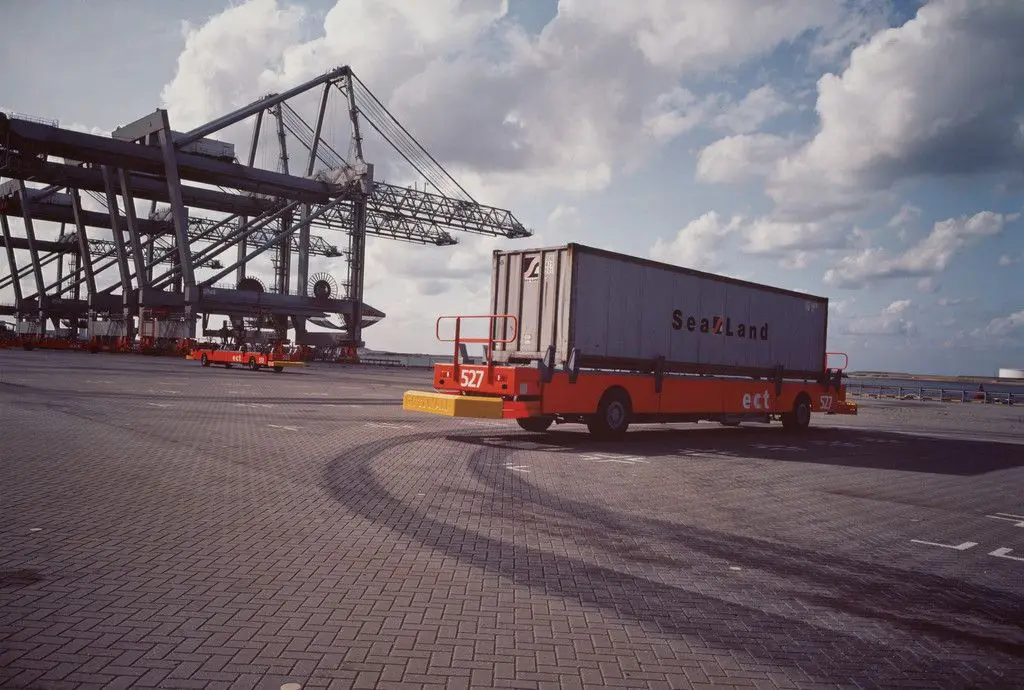 Testing robot-truck designed to move containers within automated ECT/Sea-Land cargo terminal. Maasvlakte, Port of Rotterdam, the Netherlands from the series Fish Story by Allan Sekula