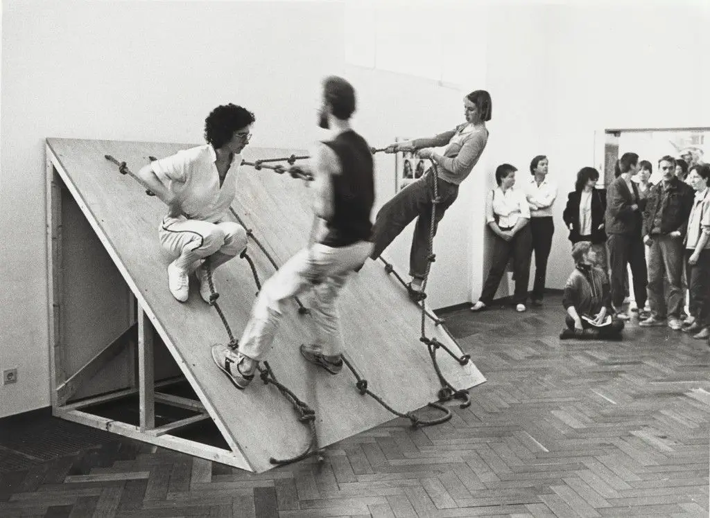 Photograph of "Slant Board Performance" at the Stedelijk Museum by Simone Forti