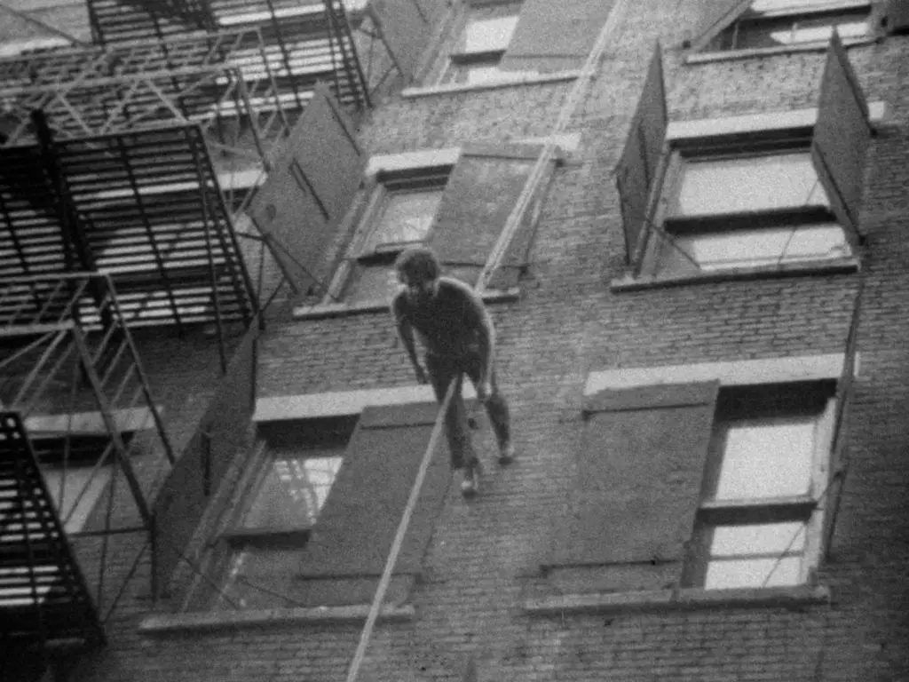 Man Walking Down the Side of a Building by Trisha Brown