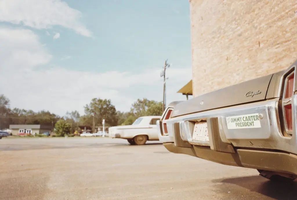 Bank Parking Lot, Plains, Georgia by William Eggleston