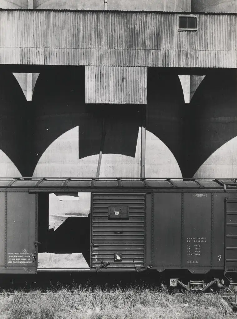 Grain Elevators and Freight Car by John Vachon