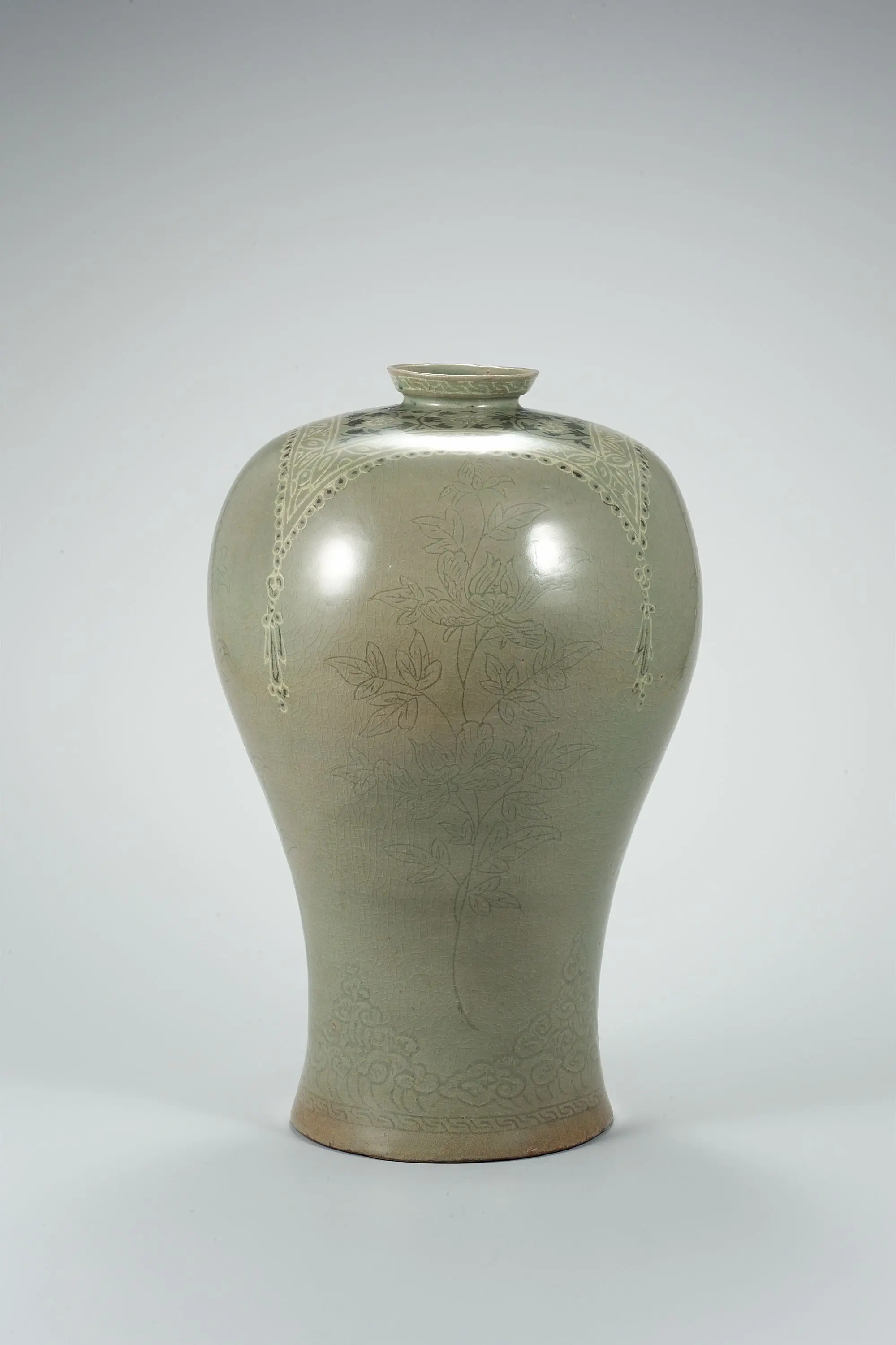 Celadon Lidded Prunus Vase with Incised Peony and Inlaid Wrapping Cloth Design by Unknown artist