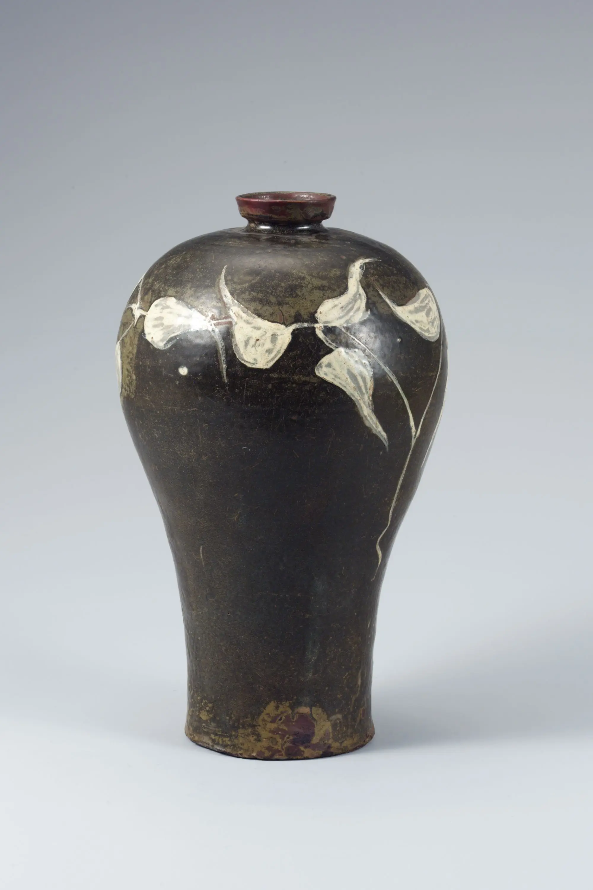 Celadon Prunus Vase Painted with Underglaze Iron Brown and Paste-on-paste Insam Leaf Design by Unknown artist