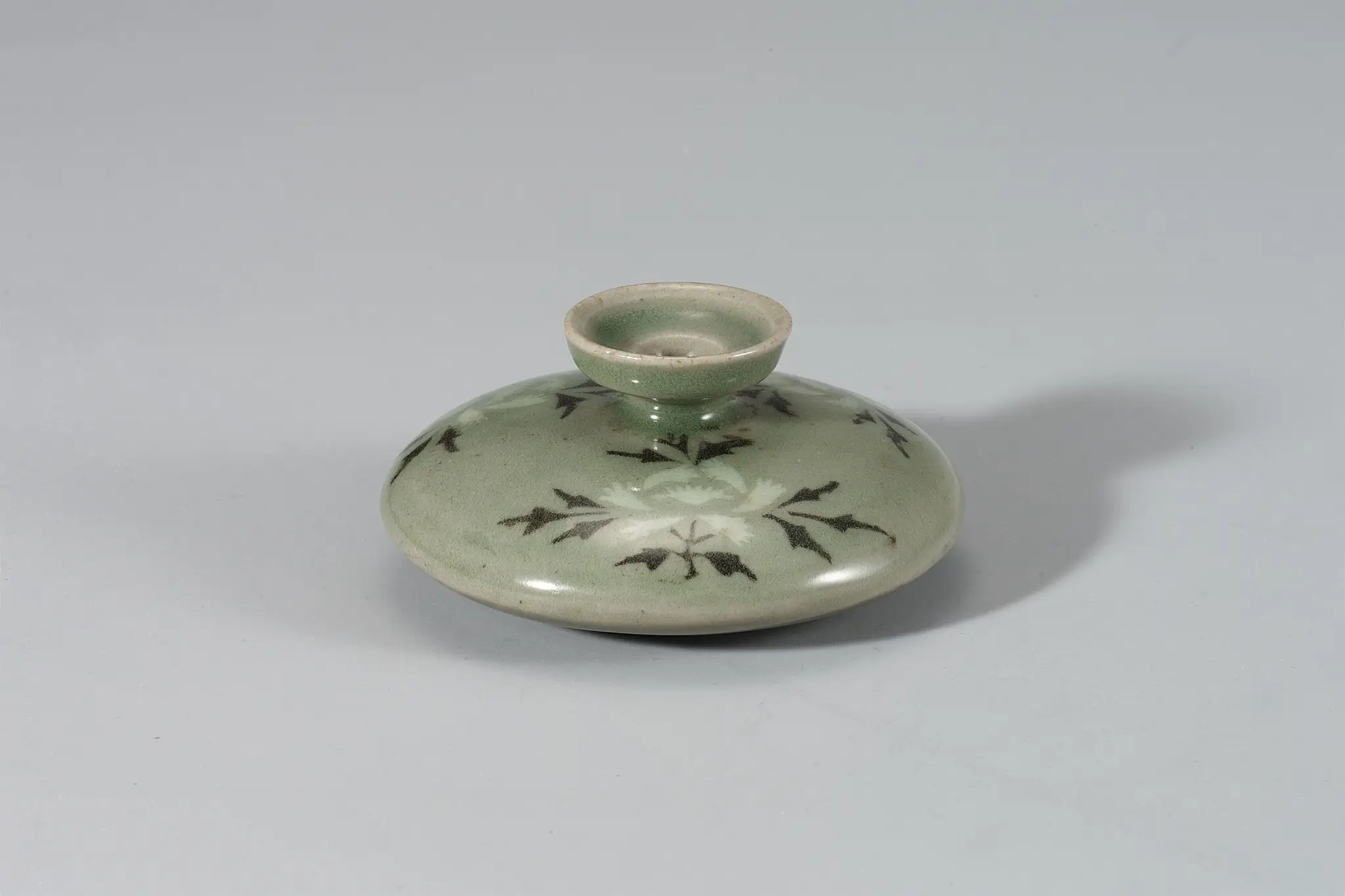 Celadon Oil Bottle with Inlaid Peony and Branch Design by Unknown artist