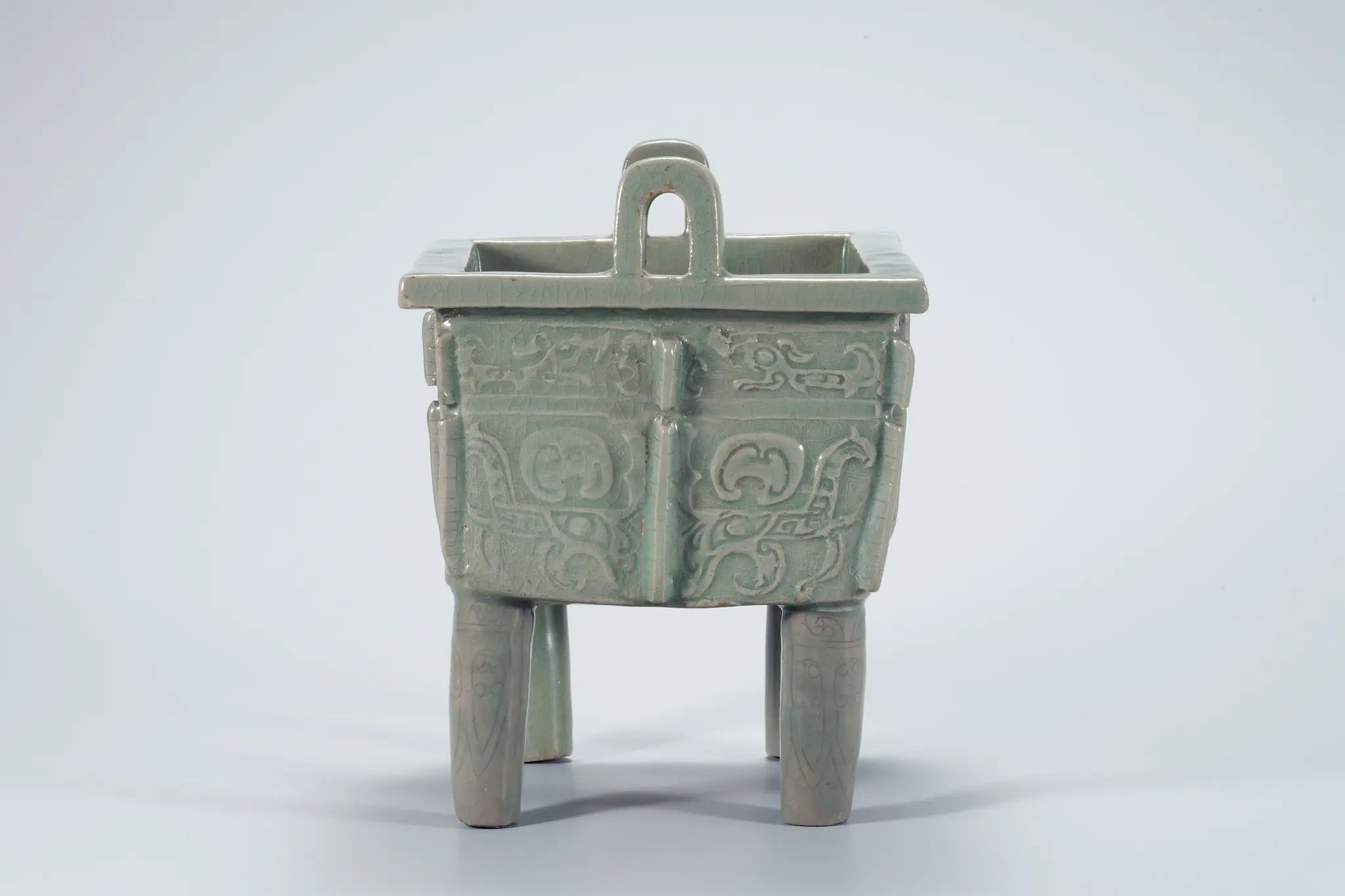 Celadon Square Incense Burner with Ogre Mask Design in Relief by Unknown artist